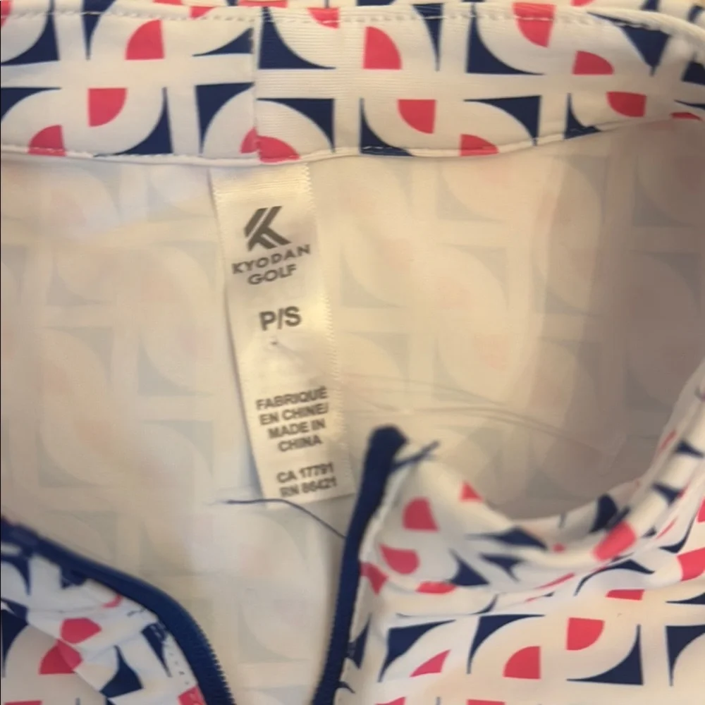 Sleeveless White and Navy Golf Outfit
Skirt with attached shorts - Picture 5 of 5